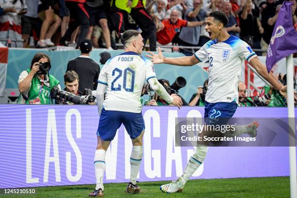 Phil Foden of England celebrates 0-2 with Jude Bellingham of England during the World Cup match between Wales v England at the Ahmad Bin Ali Stadium...