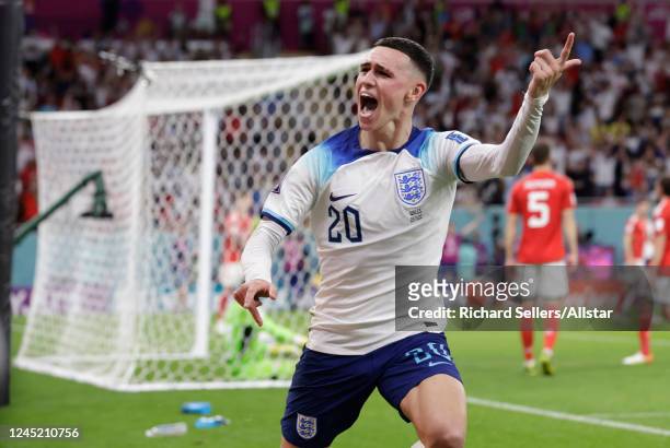 Phil Foden of England celebrates the second goal during the FIFA World Cup Qatar 2022 Group B match between Wales and England at Al Janoub Stadium on...