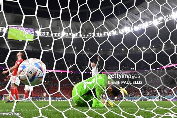 Wales' goalkeeper Danny Ward reacts after conceding a goal by England's forward Marcus Rashford during the Qatar 2022 World Cup Group B football...