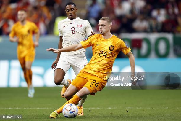 Pedro Miguel of Qatar, Kenneth Taylor of Holland during the FIFA World Cup Qatar 2022 group A match between the Netherlands and Qatar at Al Bayt...