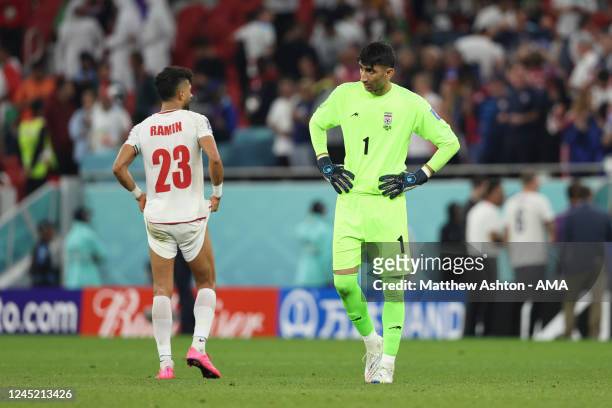 Dejected Alireza Beiranvand and Ramin Rezaeian of Iran as their team is knocked out of the FIFA World Cup in the group stage during the FIFA World...