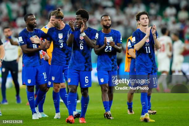 Players celebrate victory after the FIFA World Cup Qatar 2022 Group B match between IR Iran and USA at Al Thumama Stadium on November 29, 2022 in...