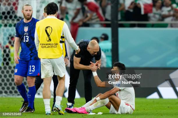 Gregg Berhalter head coach of USA and Ramin Rezaeian right-back of Iran and Sepahan FC greet each other after the FIFA World Cup Qatar 2022 Group B...