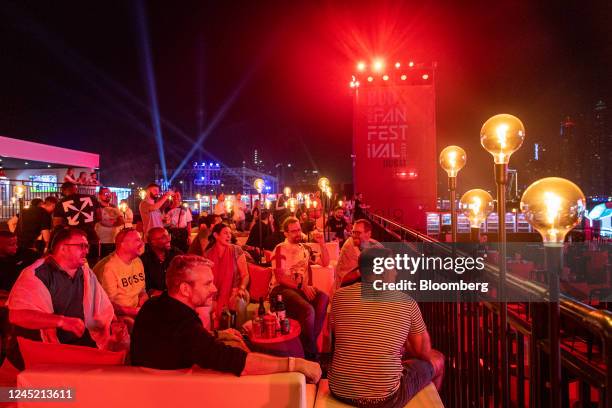 Fans watch the FIFA World Cup 2022 match between Wales and England at the BudX FIFA Fan Festival at Dubai Harbour in Dubai, United Arab Emirates, on...