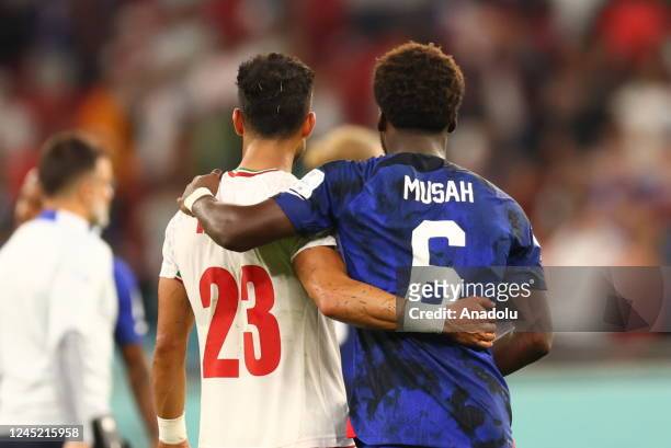 Yunus Musah of USA and Ramin Rezaeian of Iran are seen after the FIFA World Cup Qatar 2022 Group B match between Iran and USA at Al Thumama Stadium...