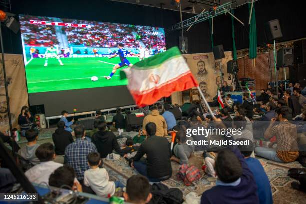 Iranian football fans watch the Qatar 2022 World Cup Group B football match against the United States in a government center on November 29, 2022 in...