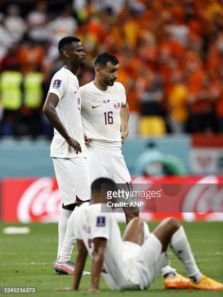 Mohammed Muntari of Qatar, Abdelkarim Hasan Fadlalla of Qatar, Boualem Khoukhi of Qatar disappointed during the FIFA World Cup Qatar 2022 group A...