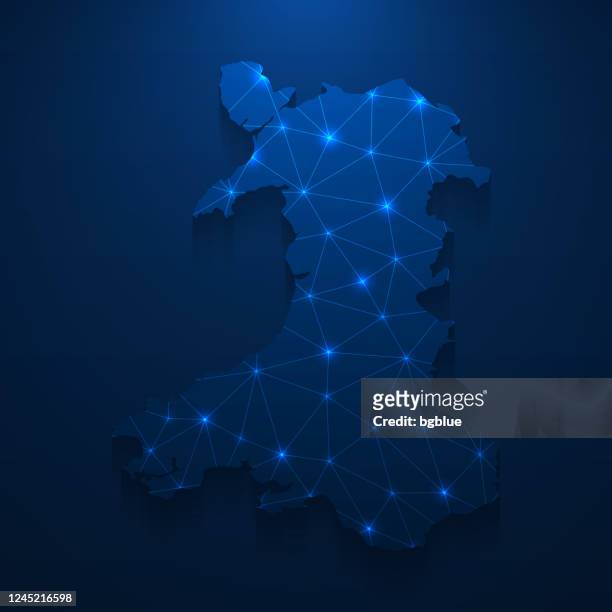 wales map network - bright mesh on dark blue background - wales map stock illustrations