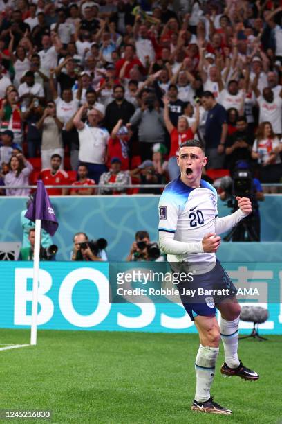 Phil Foden of England celebrates after scoring a goal to make it 0-2 during the FIFA World Cup Qatar 2022 Group B match between Wales and England at...