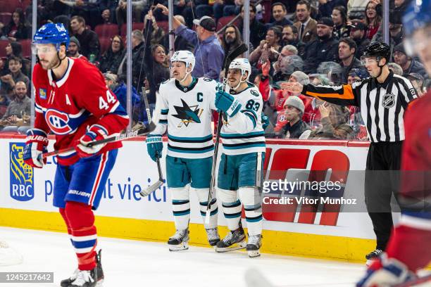 Logan Couture and Matt Nieto of the San Jose Sharks celebrate after a goal during the first period of the NHL regular season game between the...