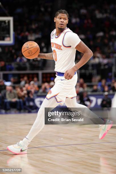 Cam Reddish of the New York Knicks handles the ball during the against the Detroit Pistons on November 29, 2022 at Little Caesars Arena in Detroit,...