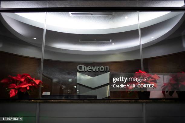 Chevron Global Technology Services Company logo is seen at an administrative office in Caracas on November 29, 2022. - The US government's...