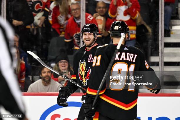 Calgary Flames Left Wing Jonathan Huberdeau celebrates a goal with Calgary Flames Center Nazem Kadri and Calgary Flames Right Wing Tyler Toffoli...