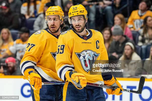 Roman Josi and Ryan McDonagh of the Nashville Predators prepare for a face-off against the Anaheim Ducks during an NHL game at Bridgestone Arena on...