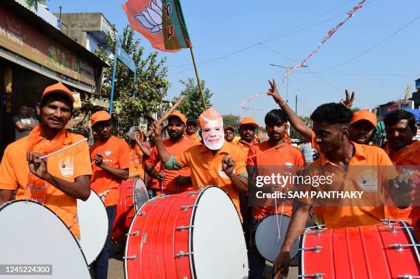 Bhartiya Janta Party supporters play drums during a roadshow attended by BJP National President JP Nadda and Gujarat's BJP candidate from...