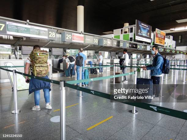 Passengers waiting for the check-in at Catania airport on June 04, 2020 in Catania, Italy. Many Italian businesses have been allowed to reopen, after...