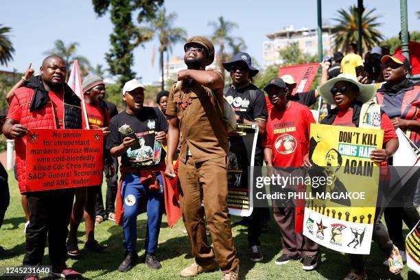 Members of the ruling African National Congress and the South African Communist Party sing and chant slogans before marching to the Kgosi Mampuru...