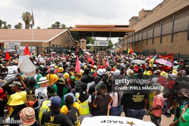 Members of the ruling African National Congress and the South African Communist Party sing and chant slogans as the picket outside the Kgosi Mampuru...