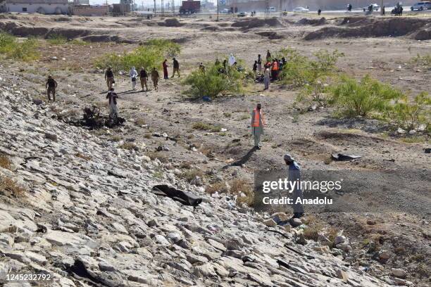 Security personnel examine surroundings, when a suspected suicide bomber blew himself up near a police vehicle in Quetta, Pakistan on November 30,...