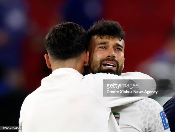 Ramin Rezaeian of Iran looks dejected after the Group B match between Iran and the United States at the 2022 FIFA World Cup at Al Thumama Stadium in...