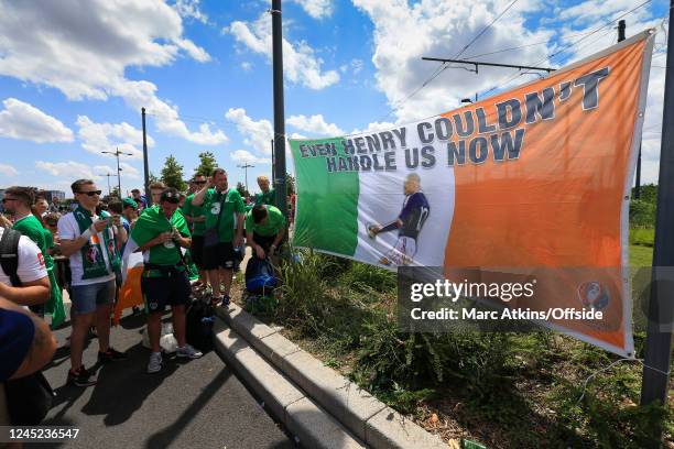 June 2016 - UEFA EURO 2016 - Round of 16 - France v Republic of Ireland - ROI fans pose with a flag bearing an image of Thierry Henry handling the...
