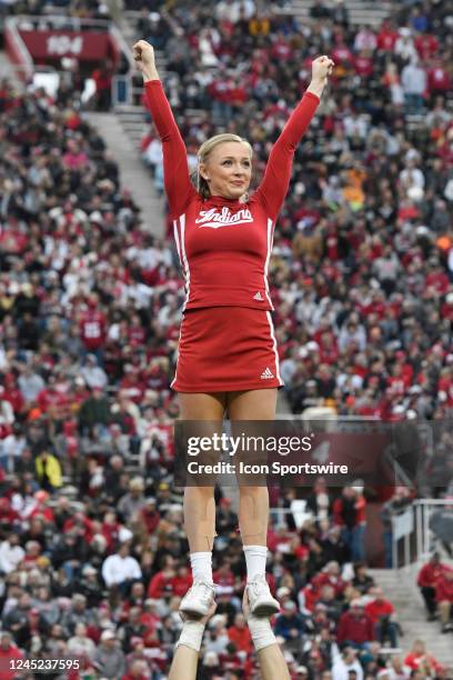 An Indiana Hoosiers cheerleader performs during the college football game between the Purdue Boilermakers and the Indiana Hoosiers on November 26 at...