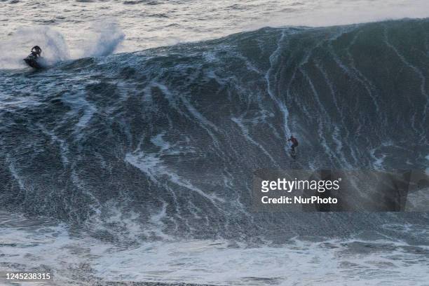 Surfers come to brave the big waves of Nazaré, on November 24, 2022