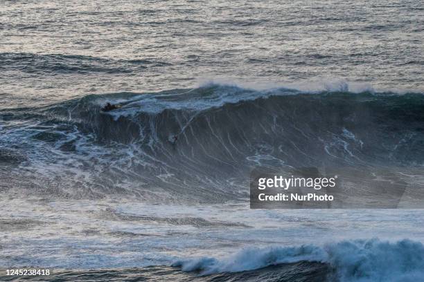 Surfers come to brave the big waves of Nazaré, on November 24, 2022