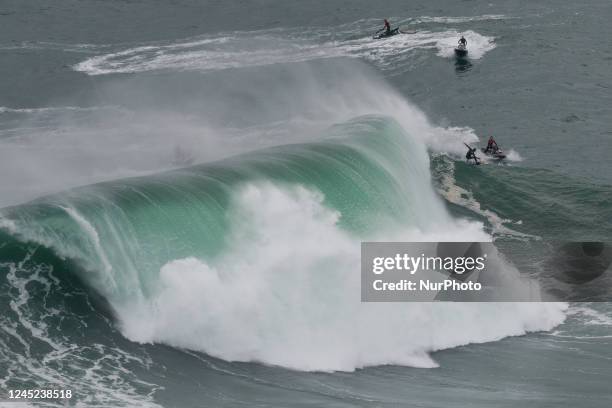 Surfers come to brave the big waves of Nazaré, on November 24, 2022