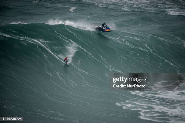 Surfers come to brave the big waves of Nazaré, on November 24, 2022