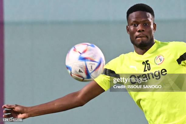 Senegal's midfielder Mamadou Loum Ndiaye takes part in a training session at Al Duhail SC in Doha on November 30, 2022 during the Qatar 2022 World...