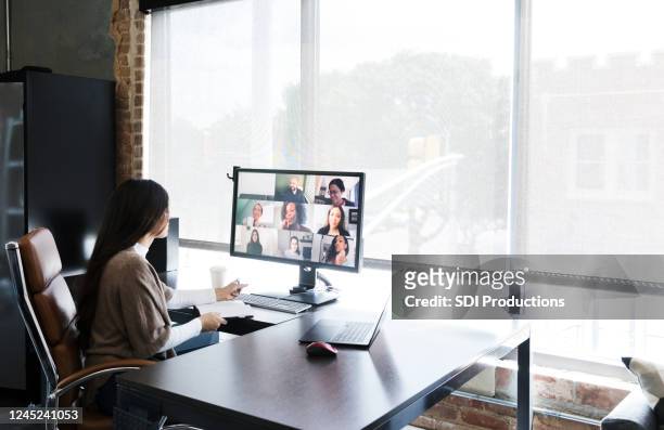 woman meets with colleagues virtually - telecommuting stock pictures, royalty-free photos & images