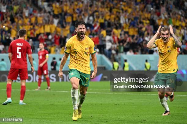 Australia's forward Mathew Leckie celebrates scoring his team's first goal during the Qatar 2022 World Cup Group D football match between Australia...