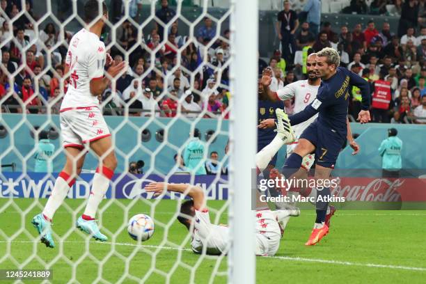 Antoine Griezmann of France scores a late goal during the FIFA World Cup Qatar 2022 Group D match between Tunisia and France at Education City...