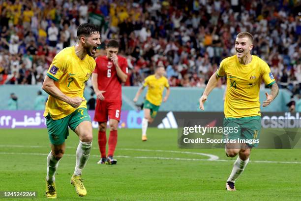 Mathew Leckie of Australia celebrates 1-0 with Riley McGree of Australia during the World Cup match between Australia v Denmark at the Al Janoub...