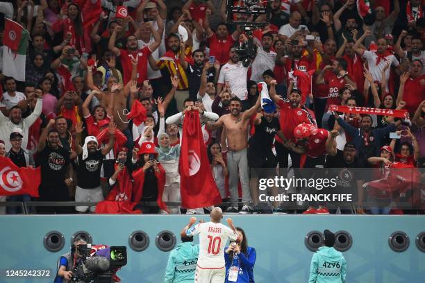 Tunisia's forward Wahbi Khazri celebrates scoring his team's first goal during the Qatar 2022 World Cup Group D football match between Tunisia and...