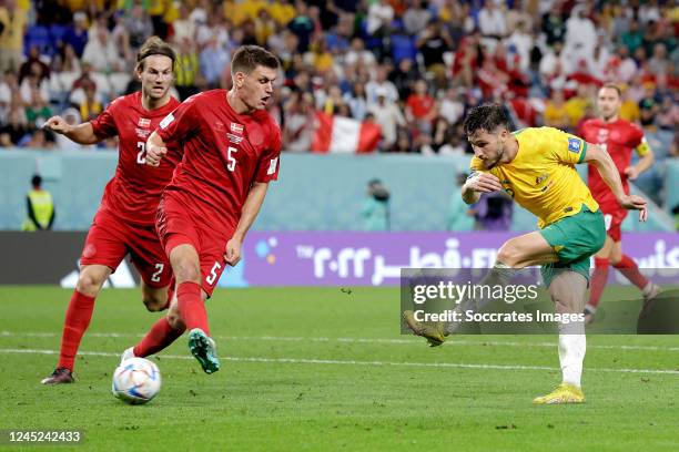 Mathew Leckie of Australia scores the first goal to make it 1-0 during the World Cup match between Australia v Denmark at the Al Janoub Stadium on...