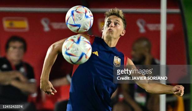 Spain's midfielder Marcos Llorente takes part in a training session at the Qatar University training ground in Doha on November 30 on the eve of the...