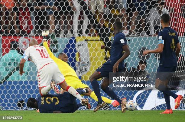 Tunisia's forward Wahbi Khazri scores his team's first goal during the Qatar 2022 World Cup Group D football match between Tunisia and France at the...