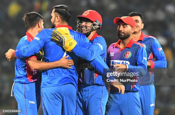 Afghanistan's Mohammad Nabi celebrates with their teammates after taking the wicket of Sri Lanka during final one-day international cricket match...