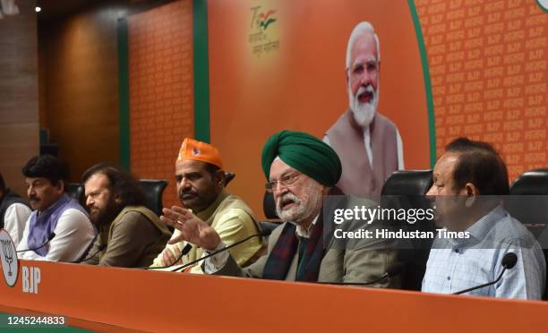 MPs Hans Raj Hans, Ramesh Bidhuri, Manoj Tiwari, Union Minister Hardeep Singh Puri, Harsh Vardhan, and Parvesh Sahib Singh Verma, during a press...