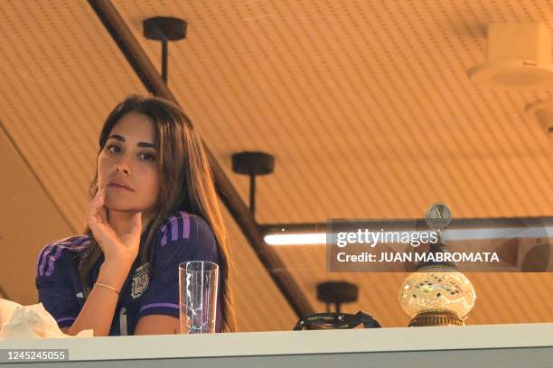 Argentina's forward Lionel Messi's wife Antonela Roccuzzo waits for the start of the Qatar 2022 World Cup Group C football match between Poland and...