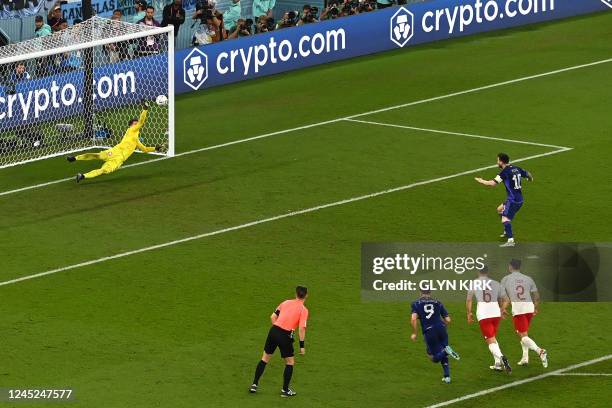 Poland's goalkeeper Wojciech Szczesny saves the penalty shot by Argentina's forward Lionel Messi during the Qatar 2022 World Cup Group C football...