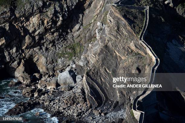 This picture taken on November 30, 2022 shows a view of the stairs and the bridge connecting Gaztelugatxe island to the mainland, near the Spanish...