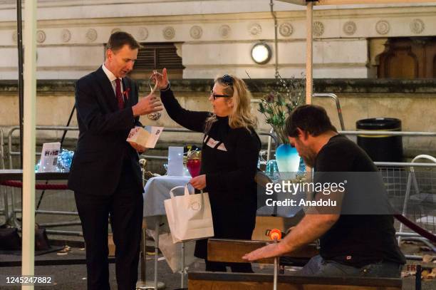 British Chancellor of the Exchequer Jeremy Hunt visits a Christmas food and drinks market set up in Downing Street to promote British small...