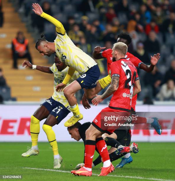 Serdar Dursun and Osayi Samuel of Fenerbahce in action against Esteban Ariel of Rayo Vallecano during the Friendship Cup soccer match between...