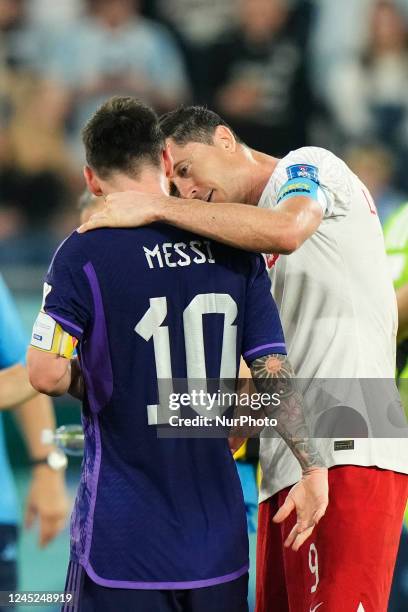 Lionel Messi right winger of Argentina and Paris Saint-Germain and Robert Lewandowski centre-forward of Poland and FC Barcelona talk after the FIFA...