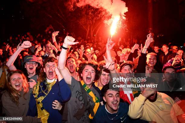 Australian fans celebrate in Melbourne on December 1 after Australia's victory over Denmark in their Qatar 2022 World Cup Group D football match.
