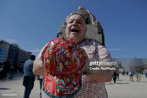 Person poses with a cap made of South Africa World Cup cans during the FIFA Fan Fest Mexico on the esplanade of the Monumento a la Revolución in...