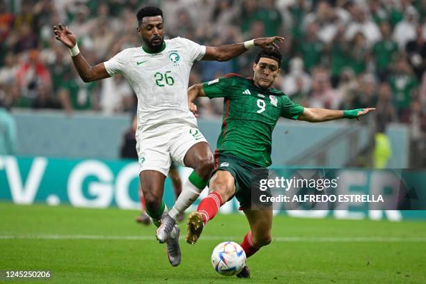 Saudi Arabia's midfielder Riyadh Sharahili fights for the ball with Mexico's forward Raul Jimenez during the Qatar 2022 World Cup Group C football...